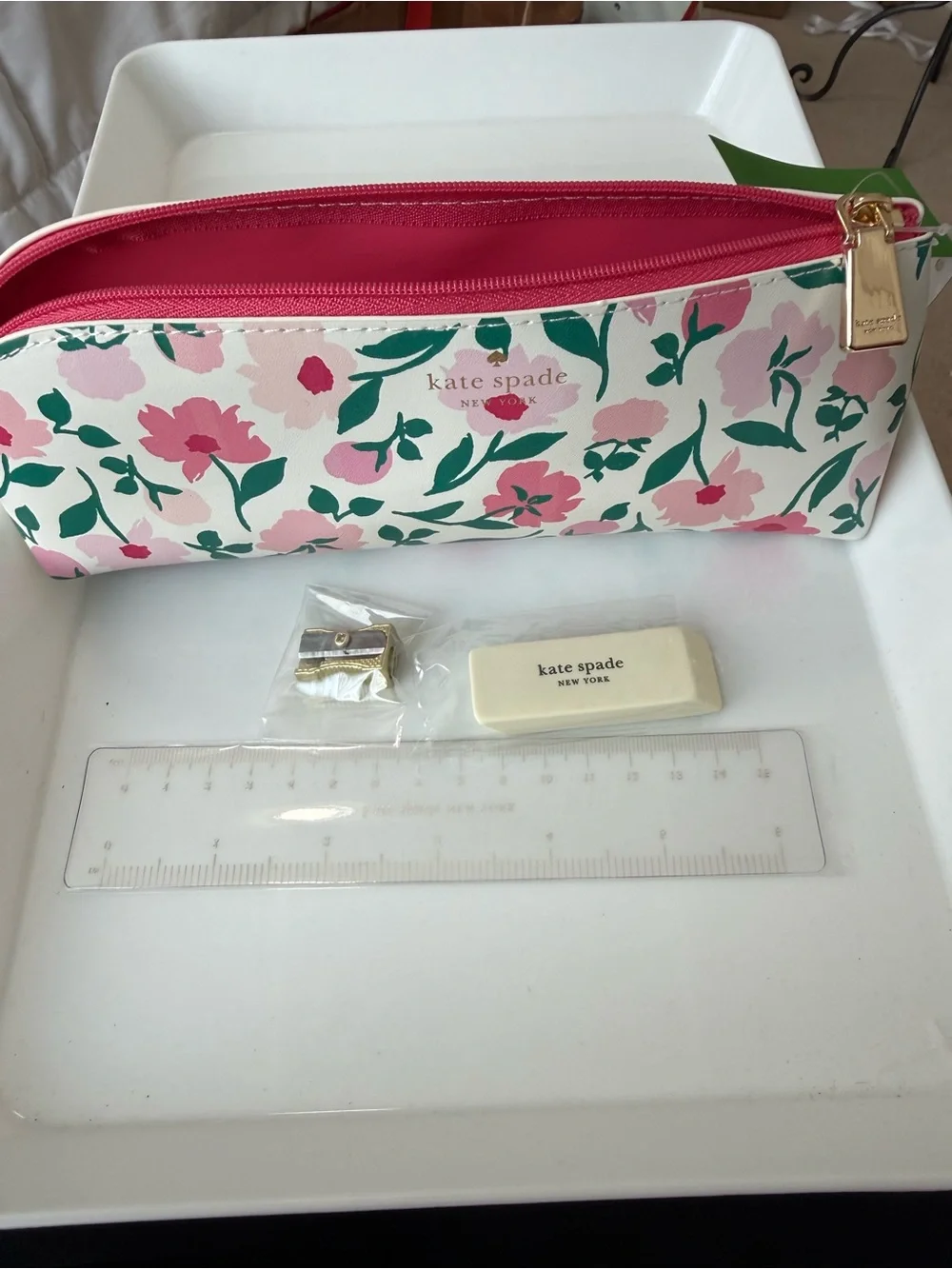 kate spade Peony party, pencil case includes sharpener, ruler, and eraser.